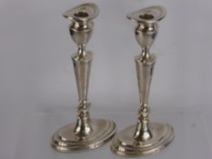 A Pair of Silver Candlesticks, London hallmark, mm Da-mar Silverware, dated 1977 mm. D.M.S.,