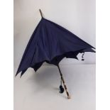 A Lady's Vintage 9 Ct Rose Gold and Bamboo Parasol, the parasol having 9 ct gold end and bands.