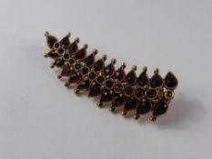 An Antique 9 Ct Yellow Gold and Garnet Leaf Brooch, 36 garnets, approx 3.4 gms.