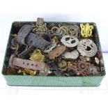 A Tin Containing a Large Collection Various Military Insignia, including badges and buttons etc.