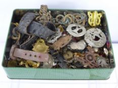 A Tin Containing a Large Collection Various Military Insignia, including badges and buttons etc.