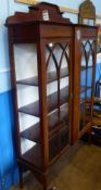 An Edwardian Glaze Fronted Display Cabinet, with three internal shelves, raised on tapered legs,