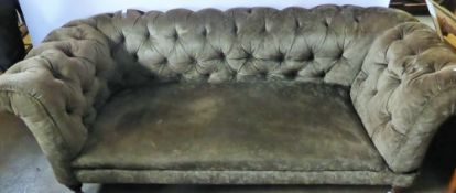 A Vintage Chesterfield Sofa, on turned legs.