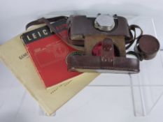 A Vintage Leica (Ernst Leitz Weztlar) Camera, no. 278021 dd 1938 together with the Leica camera