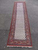 A Middle Eastern Woollen Hand Made Runner, approx 310 x 82 cms.