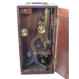 An Antique Brass Microscope, in the original mahogany case.