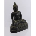 An Antique Cast Metal Figure of a seated Buddha, approx 18 cms high.