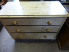 A Pine Chest of Drawers, three graduated drawers, on turned feet, approx 104 x 49 x 80 cms.