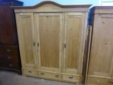 A Pine Wardrobe, with two hanging cupboards and three drawers beneath, approx 182 x 160 cms