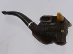 A Gentleman's Briar Pipe in the form of a horned bull's head.