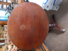 An Antique Mahogany Circular Tilt Top Table, supported on turned column with tripod base.