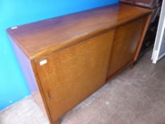 A Circa 1940's David Joel Birds Eye Maple Side Board, with two sliding doors and fitted interior,