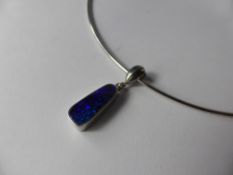 A Lady's 18 Ct White Gold Cable Necklace and Black Opal Pendant, opal 175 x 7 mm, approx wt 2.9 gms,