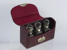 A Trio of Cut Glass Silver Collared Perfume Bottles, Birmingham hallmark, dd 1899, in the original