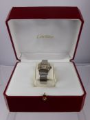 A Lady's Cartier Santos Stainless Steel and 18 Ct Gold Wrist Watch. No. 1567954589CD. The watch