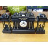 A Black Slate Architectural Mantel Clock with Garniture, the mechanism stamped JJS, the plinth