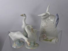 Four Lladro Figurines including Lladro Society Scroll, two figures of geese and one of a duck.