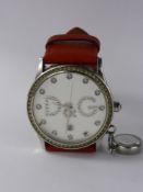 A Lady's Stainless Steel D & G Wrist Watch, with red leather strap.