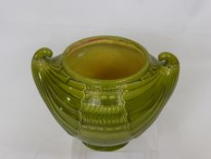 An Art Nouveau Bretby Green Glazed Jardiniere, with upswept feathered design, approx 35 cms (AF)