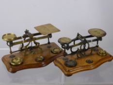 Two Brass Postal Scales, one stamped 'warranted accurate' both sets complete with weights.