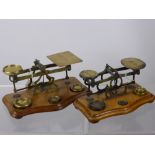 Two Brass Postal Scales, one stamped 'warranted accurate' both sets complete with weights.