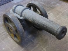 An Antique Floor Standing Starter Cannon supported on a carriage, length of barrel approx 47cm.