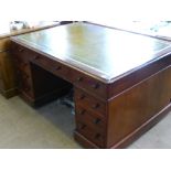 A Mahogany Partner's Desk, a central long drawer with four short drawers to one side, a central long