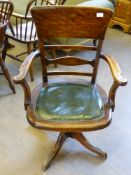 An Antique Boardroom/Captain's Chair, slat back, on splayed legs with leather seat.