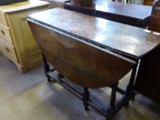 An Antique Oak Drop Leaf Gate Leg Table, approx 107 x 40 x 120 cms.