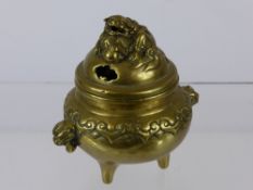 Antique Chinese Brass Censer, having a Foo Dog with one foot rested on a pearl, with stylized