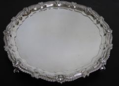A Fine Solid Silver Salver, the salver having scalloped edge with shell and laurel design and on