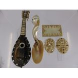 An Antique Miniature Tortoiseshell Bone and Mother of Pearl Mandolin, together with an abalone shell