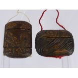 Two Oriental Carved Inro, one intricately carved with a chasing dragon, approx 10 x 7.5 x 4 cms, the