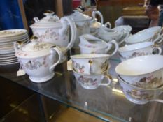 A Japanese Porcelain Tea Set, 'Sunny China' decorated with chasing dragons, comprising tea pot, milk