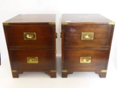 Two Bedside Cabinets, in the style of campaign furniture with oval brass plaque to top, two