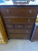 A Pair of Stagg Chests of Drawers, four long drawers and three short, on bracket feet, approx 82 x