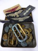 A Miscellaneous Collectiion of WW1 and WW2 Cap Badges, buttons including cloth.