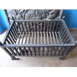 A Cast Iron Fire Grate Basket, on decorative wrought feet, approx 46 x 77 x 42 cms.