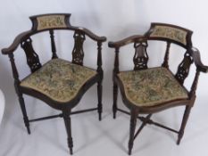 Two Edwardian Corner Chairs, with lyre back design, cross stretchers on tapered legs. (2)