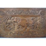 A Carved Wooden Panel, depicting an Indian Elephant and Mahout, approx 68 x 41 cms.