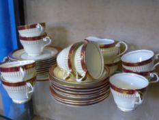 A Part Aynsley Bone China Tea Set, comprising nine cake plates, one sandwich plate, nine tea cups,