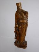 An Antique Oriental Okimono, carved wood figure depicting a wise man, approx 20 cms high. (af)