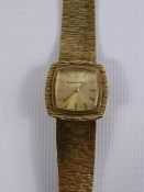 A Lady's Bueche-Girod 9ct Gold Wrist Watch, having bark finish bracelet and surround, gold face with