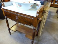 A Mahogany Marble Top Wash Stand, with carved towel rail, supported on turned legs with lower shelf,