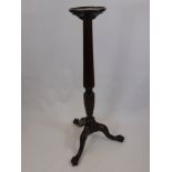 A Mahogany Torchere with Reeded Column, supported on splayed legs with ball and claw feet, approx