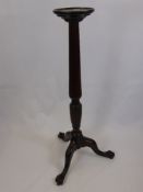 A Mahogany Torchere with Reeded Column, supported on splayed legs with ball and claw feet, approx