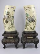 An Impressive Pair of Japanese Shibayama Tusk Vases, Meiji Period, finely inlaid in mother of pearl,