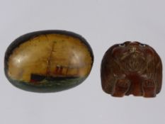 An Antique Hand Painted Nut/Seed Pod, hand painted an ocean steam liner, with carved lions head mask