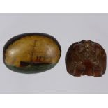 An Antique Hand Painted Nut/Seed Pod, hand painted an ocean steam liner, with carved lions head mask