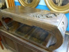 An Opium Table, with single drawer, carving to top in the form of a fan depicting figures on a